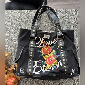 Ed Hardy purse with peeling on faux handles rest is still in excellent condition